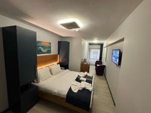 Postel nebo postele na pokoji v ubytování VAMA TAKSİM Hotel