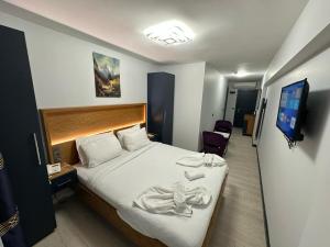 Postel nebo postele na pokoji v ubytování VAMA TAKSİM Hotel