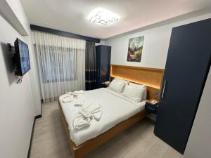 Postel nebo postele na pokoji v ubytování VAMA TAKSİM Hotel