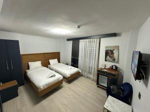 Postel nebo postele na pokoji v ubytování VAMA TAKSİM Hotel
