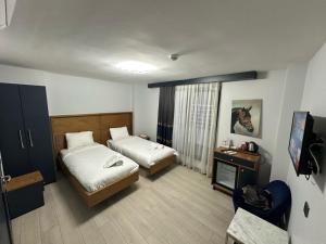 Postel nebo postele na pokoji v ubytování VAMA TAKSİM Hotel