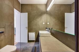 a bathroom with a sink and a toilet at Douro River Studios in Porto +43 photos