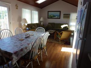 a kitchen and living room with a table and chairs at Wi-Fi, Patio, Yard, Balcony, Deck, Ocean Side Duplex 1St Floor In Ship Bottom 10609 in Ship Bottom +10 photos