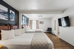 Postel nebo postele na pokoji v ubytování Adventure Inn Durango