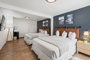 Postel nebo postele na pokoji v ubytování Adventure Inn Durango
