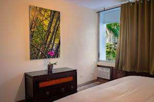 Postel nebo postele na pokoji v ubytování Casa Orquídea Panamá