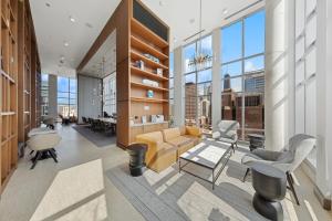 a living room with a couch and chairs in a building at Kasa River North Chicago in Chicago