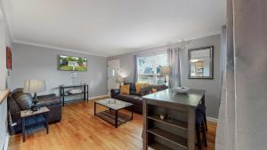 a living room with a couch and a table at Great two bedroom family spot with convenient access to downtown in Denver
