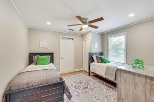 a bedroom with two beds and a ceiling fan at Golfers Getaway Mins to Masters Grill and Chill! in Augusta
