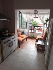 a living room with a couch and a table at La Mar en Coche in San Salvador de Jujuy