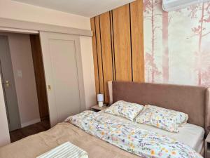 a bedroom with a bed with two pillows on it at Apartament Balladyny in Lublin
