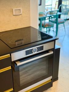 a stove top oven sitting in a kitchen at Lovely 1-bedroom apartment in The best location in Tel Aviv +13 photos