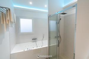 a bathroom with a shower and a glass shower stall at Paradisier in Villars-les-Dombes +11 photos