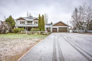 a house with a driveway in front of it at Country Way Inn in Kalispell