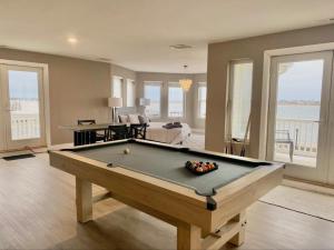 a living room with a pool table in it at Icon Playce: Beachfront with 360 rooftop in Atlantic City
