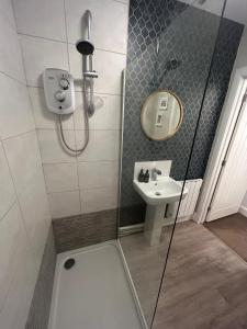 a bathroom with a shower and a sink at Alba Apartment Central Pitlochry in Pitlochry +13 photos
