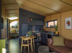 a kitchen and living room in a tiny house at Skylark Cabin in Twizel