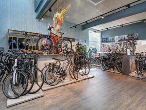 a store filled with lots of bikes on display at Historic Cottage w Garden in Breskens
