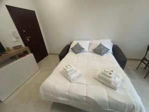 Postel nebo postele na pokoji v ubytování Carradori Apartment-Centro Storico-Autodromo + 11 fotografií