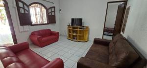Televisyen dan/atau pusat hiburan di Casa Temporada Encanto do Mar