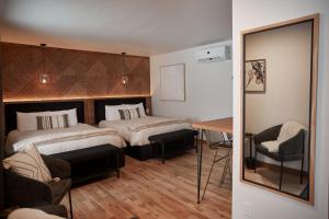 Voodi või voodid majutusasutuse Motel Boutique Hygge toas +37 fotot