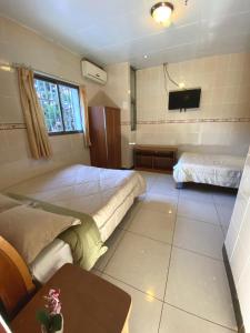 Voodi või voodid majutusasutuse Hotel Guanacaste toas