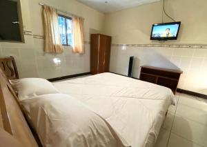 Voodi või voodid majutusasutuse Hotel Guanacaste toas