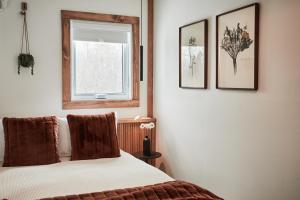Voodi või voodid majutusasutuse Motel Boutique Hygge toas