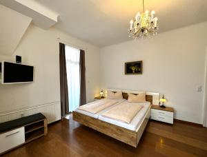 Postel nebo postele na pokoji v ubytování Hotel Zu den Linden
