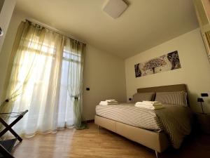 Ένα ή περισσότερα κρεβάτια σε δωμάτιο στο Casa Cristina