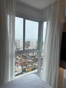 Postel nebo postele na pokoji v ubytování Apart Moderno Proximo ao Mar + 31 fotografií