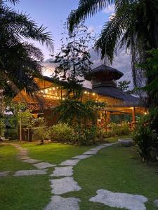 a building with a pathway in front of it at Corcovado Renting Houses-Villas-Tents-Nature-Great Views in Palo Seco