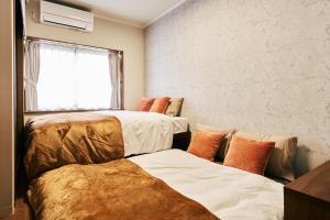 Cama o camas de una habitación en 京成立石駅 徒歩10分 スカイツリー7分 浅草10分 最大10名 家族滞在 羽田成田空港直通