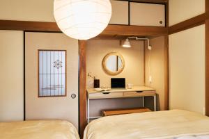 Cama o camas de una habitación en 京成立石駅 徒歩10分 スカイツリー7分 浅草10分 最大10名 家族滞在 羽田成田空港直通