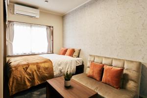 Cama o camas de una habitación en 京成立石駅 徒歩10分 スカイツリー7分 浅草10分 最大10名 家族滞在 羽田成田空港直通