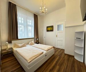 Postel nebo postele na pokoji v ubytování Hotel Zu den Linden