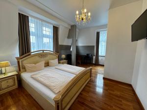 Postel nebo postele na pokoji v ubytování Hotel Zu den Linden