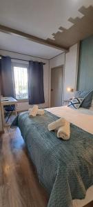 Postel nebo postele na pokoji v ubytování Villa Palma