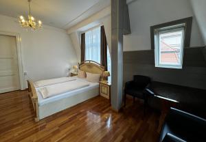Postel nebo postele na pokoji v ubytování Hotel Zu den Linden