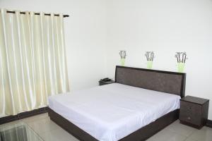 Hotel Sukoon客房内的一张或多张床位