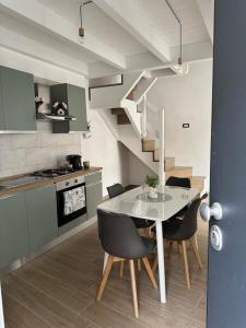 a kitchen and dining room with a table and chairs at Nonna Lisetta in Terzigno +45 photos