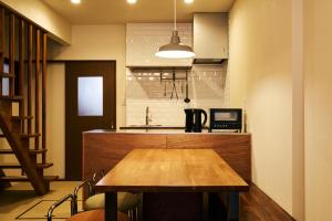 Una cocina o zona de cocina en 京成立石駅 徒歩10分 スカイツリー7分 浅草10分 最大10名 家族滞在 羽田成田空港直通