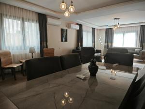a living room with a couch and a table at Adakonak Urla in Urla