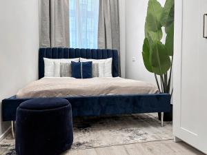 Tempat tidur dalam kamar di Aparthotel Odeon I Self Check In
