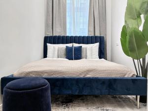 Tempat tidur dalam kamar di Aparthotel Odeon I Self Check In