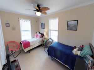 a bedroom with two beds and a ceiling fan at Spacious, Light And Bright Ship Bottom Ocean Block Home Only 7 Houses From The Beach With Outdoor Entertaining Area 14018 in Ship Bottom +16 photos