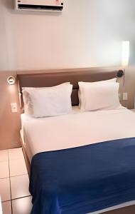 Postel nebo postele na pokoji v ubytování Apartamento em Beach Class Praia de Iracema Por CasAmarInn + 25 fotografií