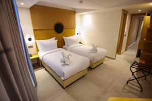 Voodi või voodid majutusasutuse FAHO Hôtel toas