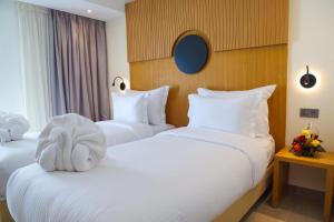 Voodi või voodid majutusasutuse FAHO Hôtel toas