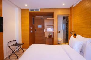 Voodi või voodid majutusasutuse FAHO Hôtel toas